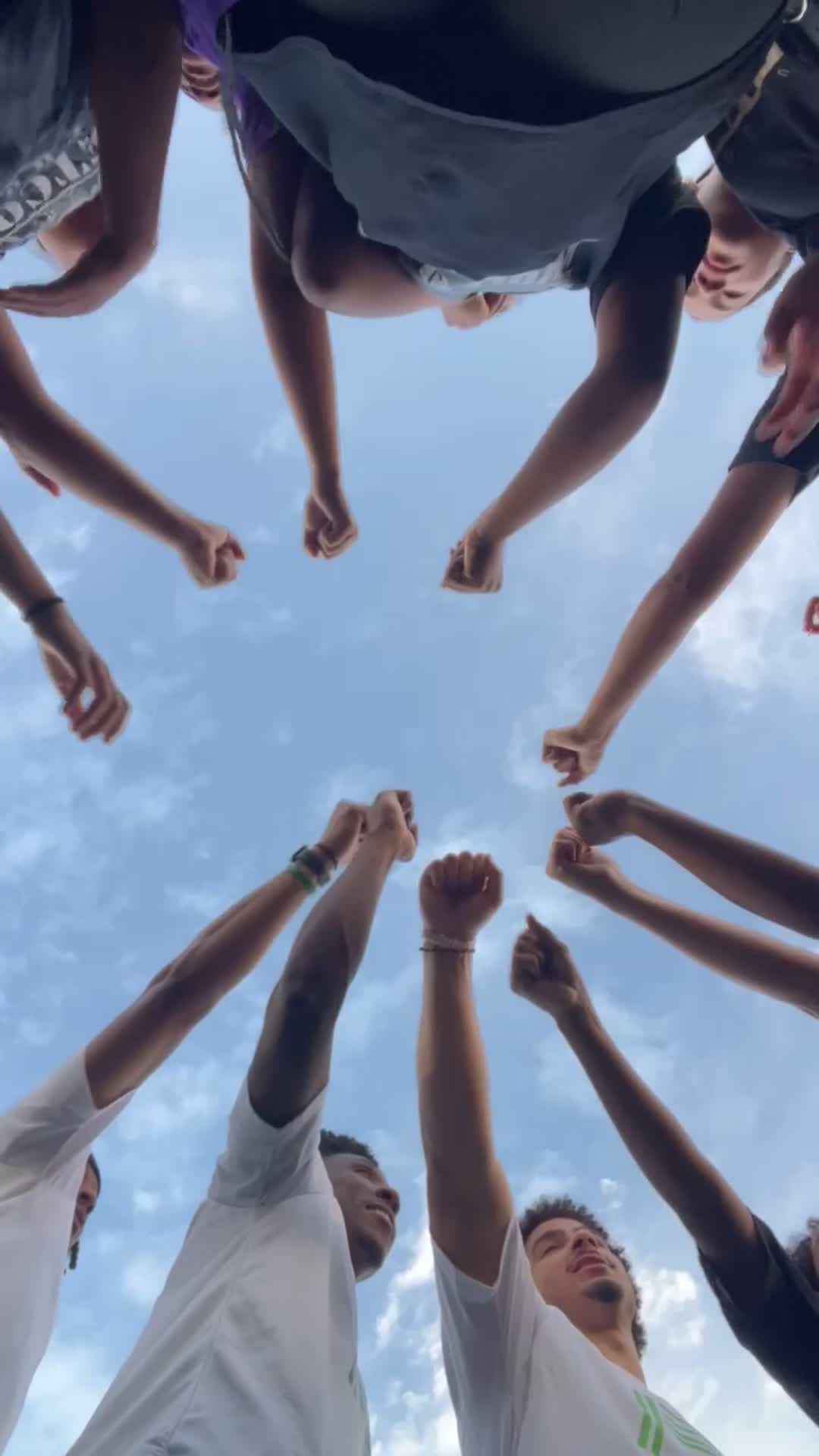 Plus2 Performance athletes bringing their hands together before training