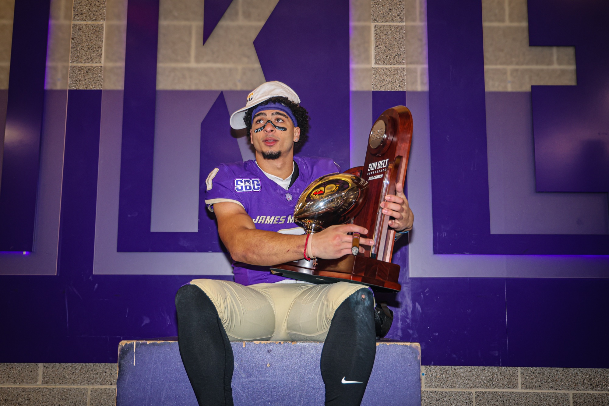 Jaylan Sanchez celebrating the 2025 Sun Belt Championship with James Madison